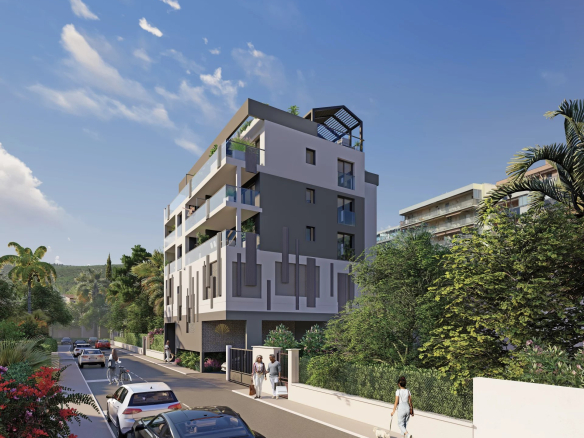 Résidence neuve à Juan-les-Pins avec architecture moderne et verdure environnante.
