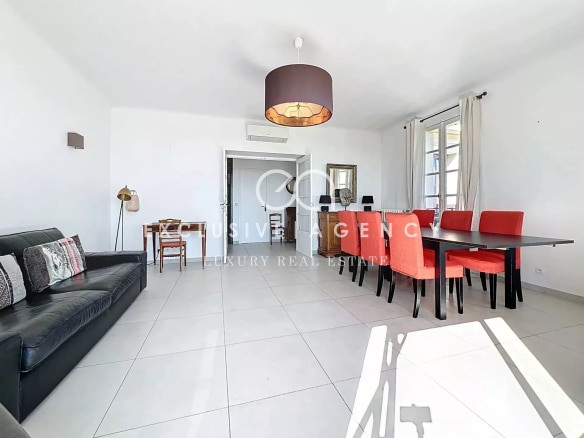 Interior of an apartment in Cannes with living room and dining room, modern and bright furniture.