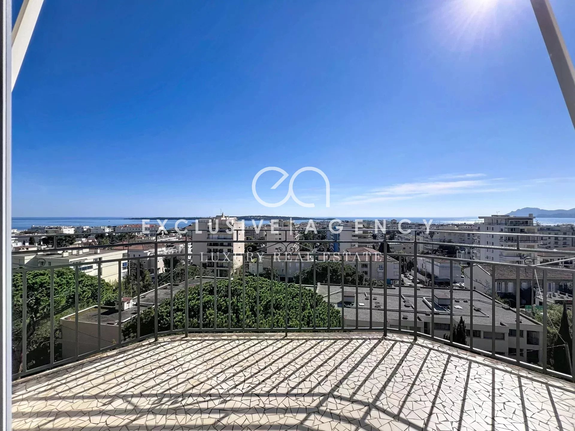 Panoramic sea view from a top-floor balcony in Cannes.