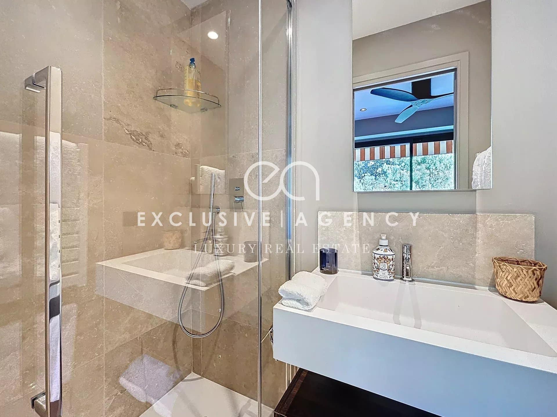 Modern bathroom with shower and sink in a renovated apartment.