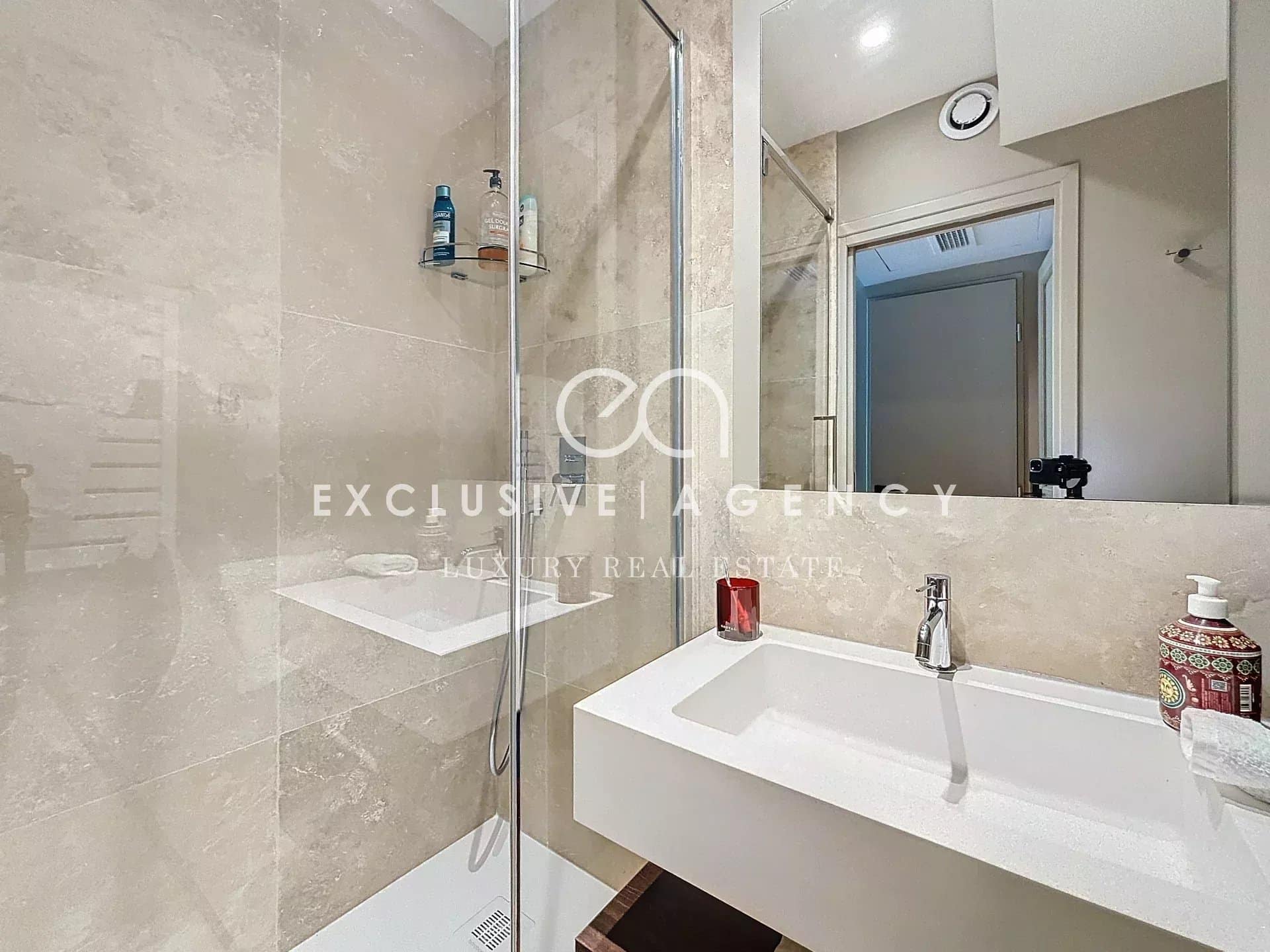 Modern bathroom with shower and sink in a renovated apartment in Golfe-Juan.