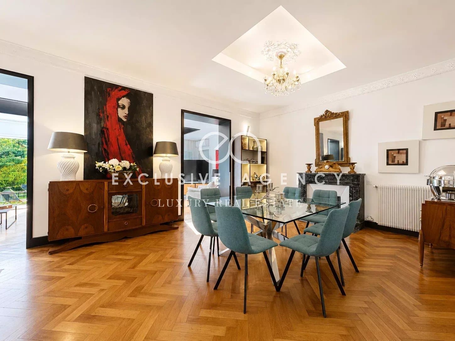 Living room of a bourgeois house in Cannes Interior of a renovated bourgeois house with an elegant living room and a glass dining table.