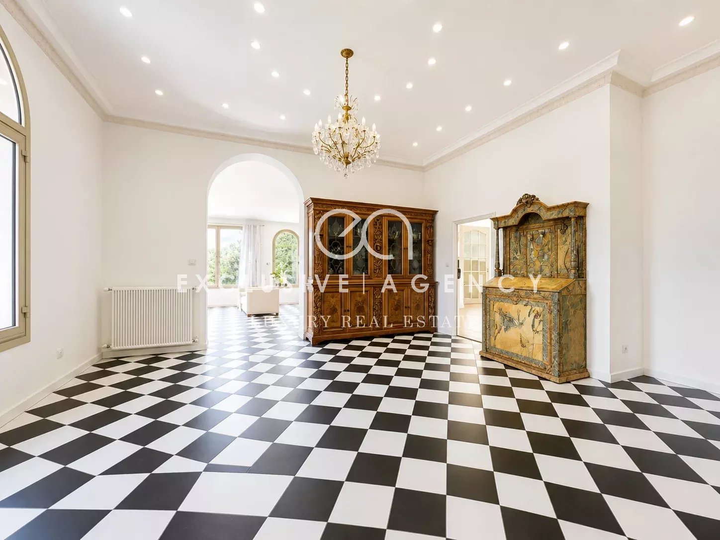Elegant interior of a villa in Cannes Interior of a villa in Cannes with a black and white checkered floor and bright lighting.