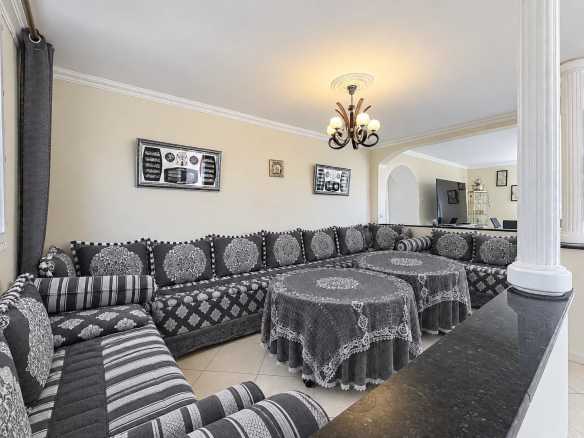Interior of a family home in Cannes with a spacious living room and modern decor.