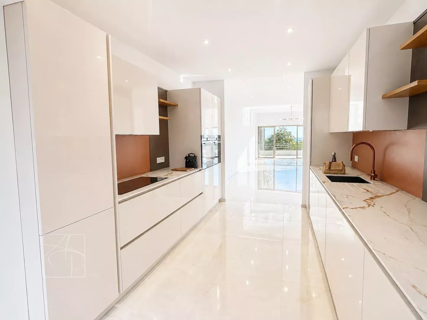 Modern and bright kitchen in a Cannes apartment with sea view