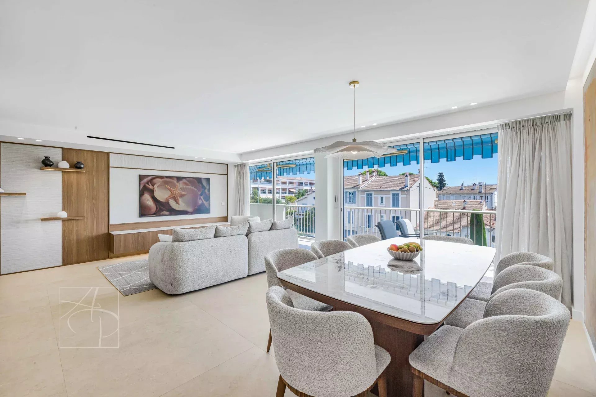 Renovated apartment in Cannes Interior of a renovated apartment with a bright living room and dining room, overlooking the sea in Cannes.