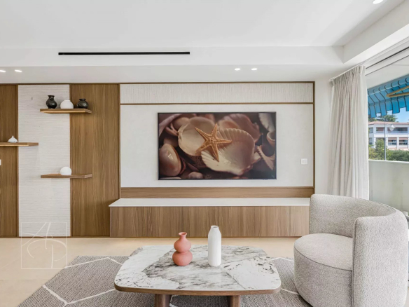 Interior of a renovated apartment with a bright and modern living room in Cannes.