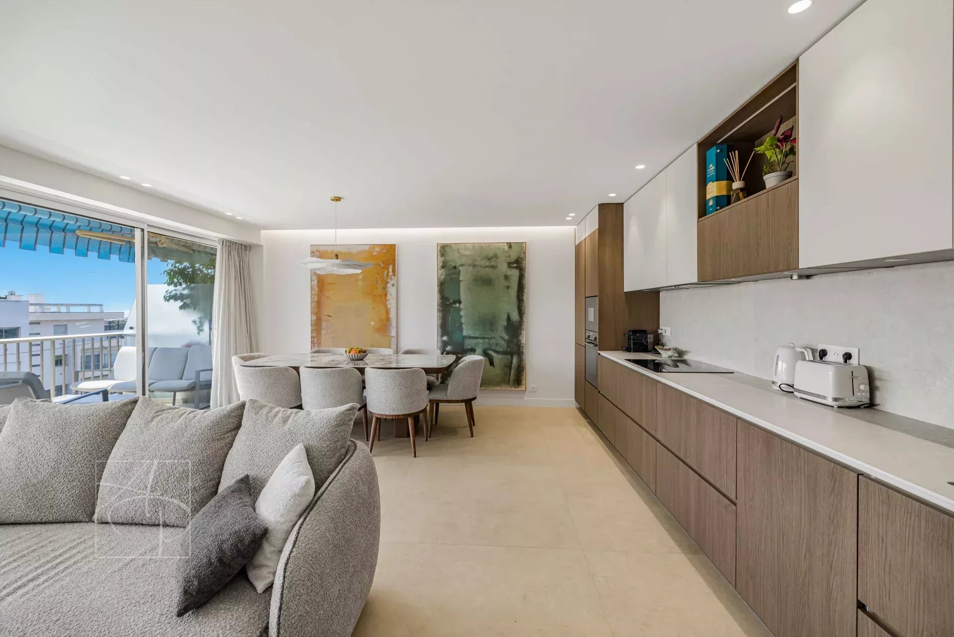 Renovated apartment in Cannes Interior of a renovated apartment in Cannes with living room, dining room and modern kitchen.