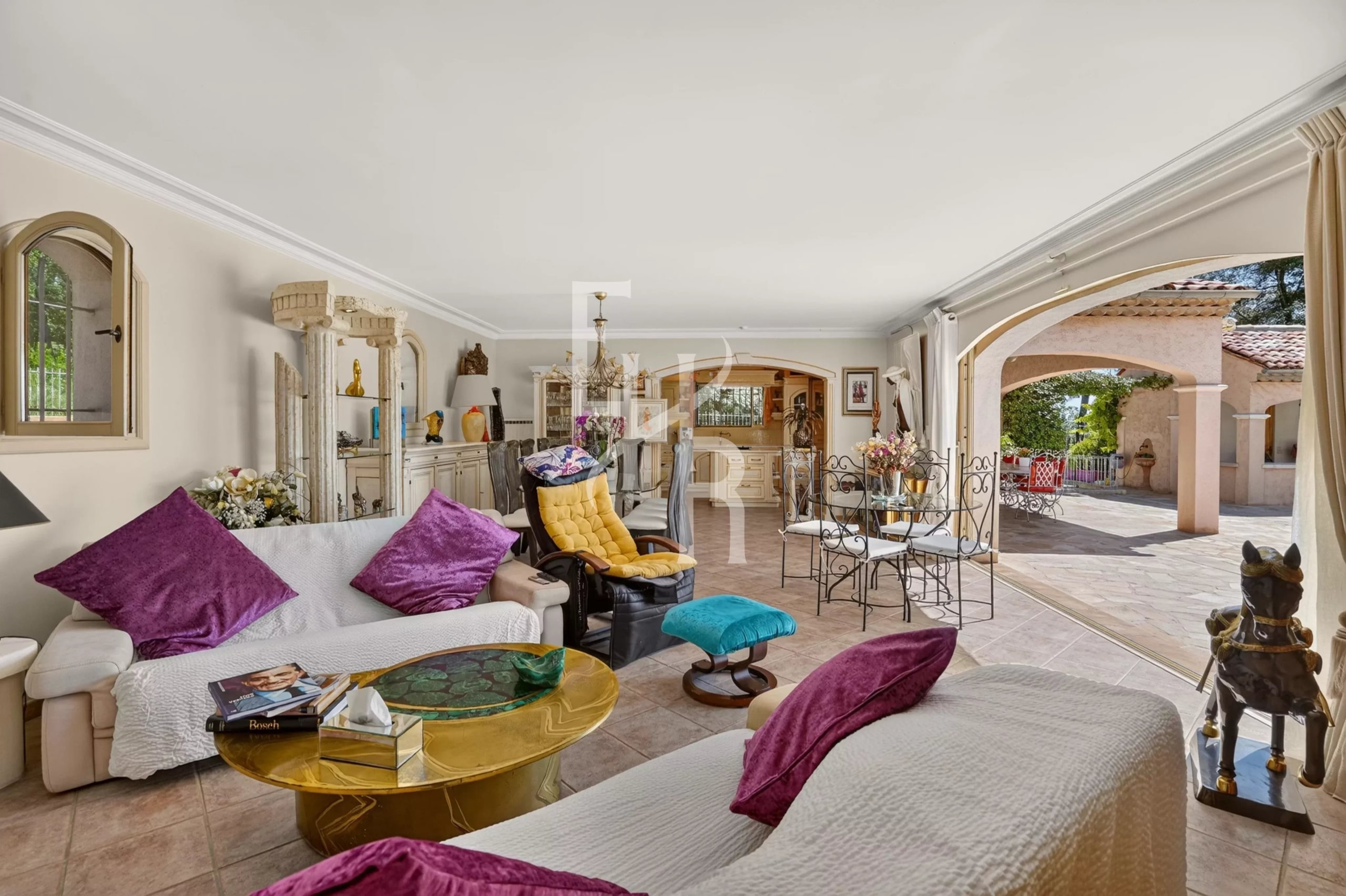 Interior of a villa in Cabris with a spacious living room and elegant furniture.