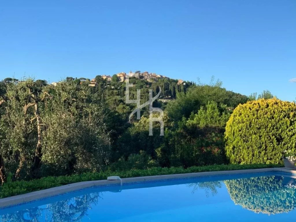Panoramic view of the old village of Mougins from a villa with a swimming pool.