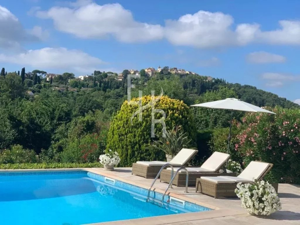 Panoramic view of the old village of Mougins from a villa with a swimming pool.