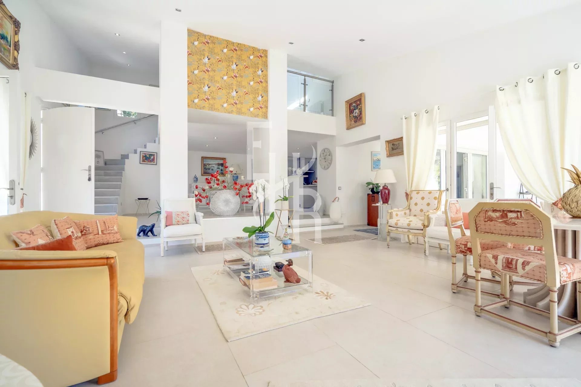 Interior of a villa in Mougins Bright interior of a renovated villa in Mougins with living room, kitchen and patio.