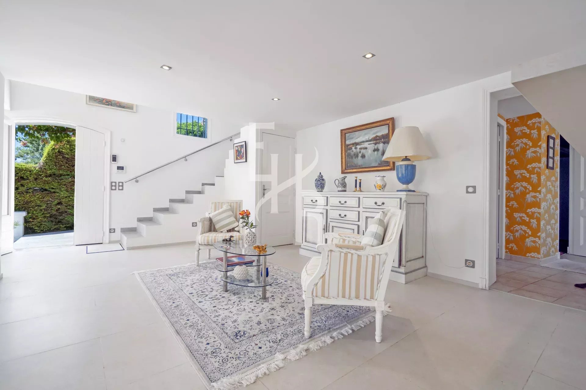 Interior of a villa in Mougins Interior of a recently renovated villa in Mougins, with a bright living room and a modern staircase.