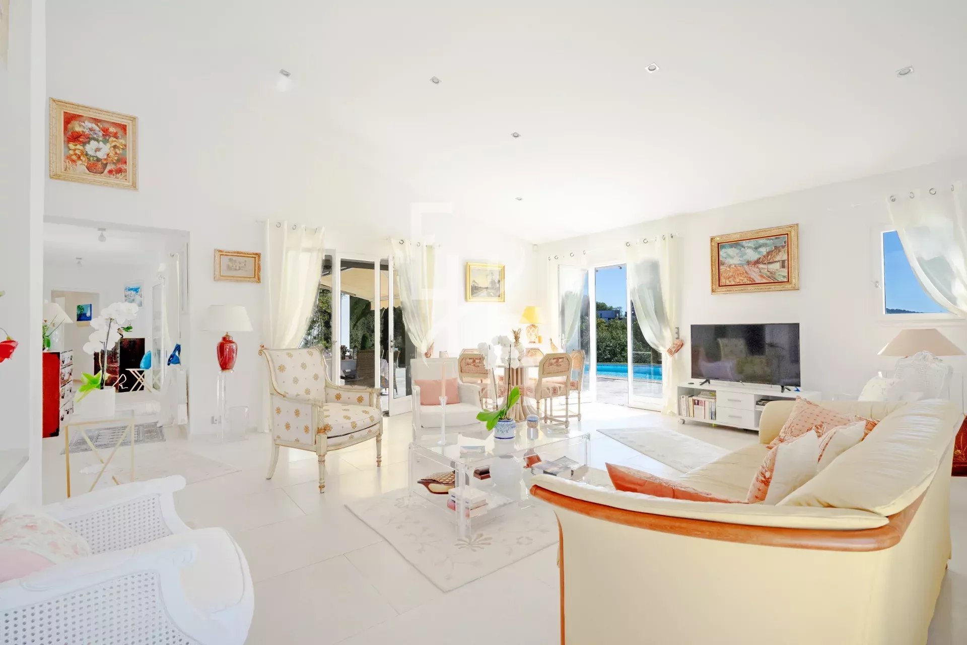 Interior of a villa in Mougins Interior of a bright villa in Mougins with living room, open-plan kitchen and patio.