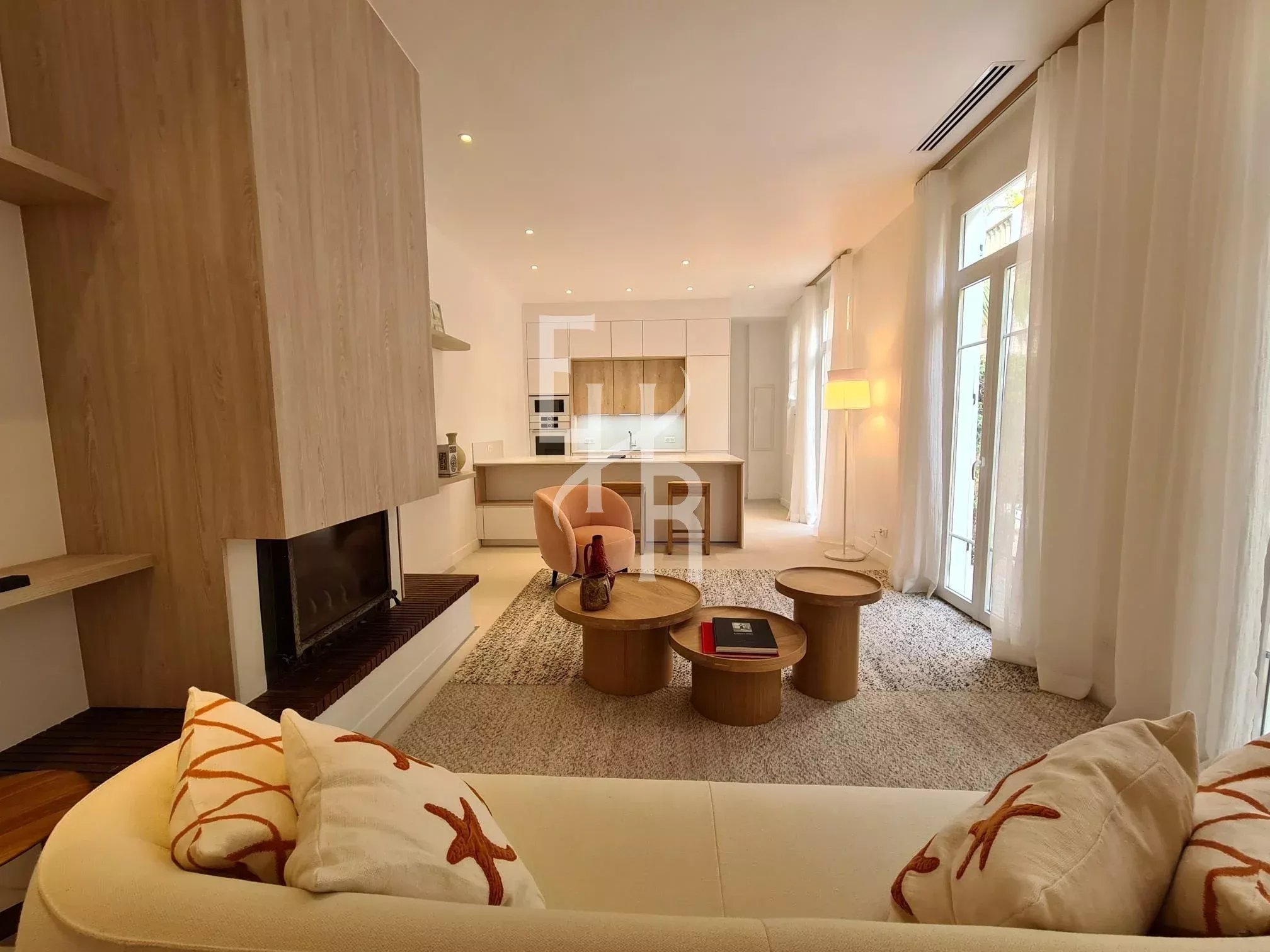 Interior of a townhouse in Cannes Interior of a townhouse in Cannes, with a bright living room and open kitchen.