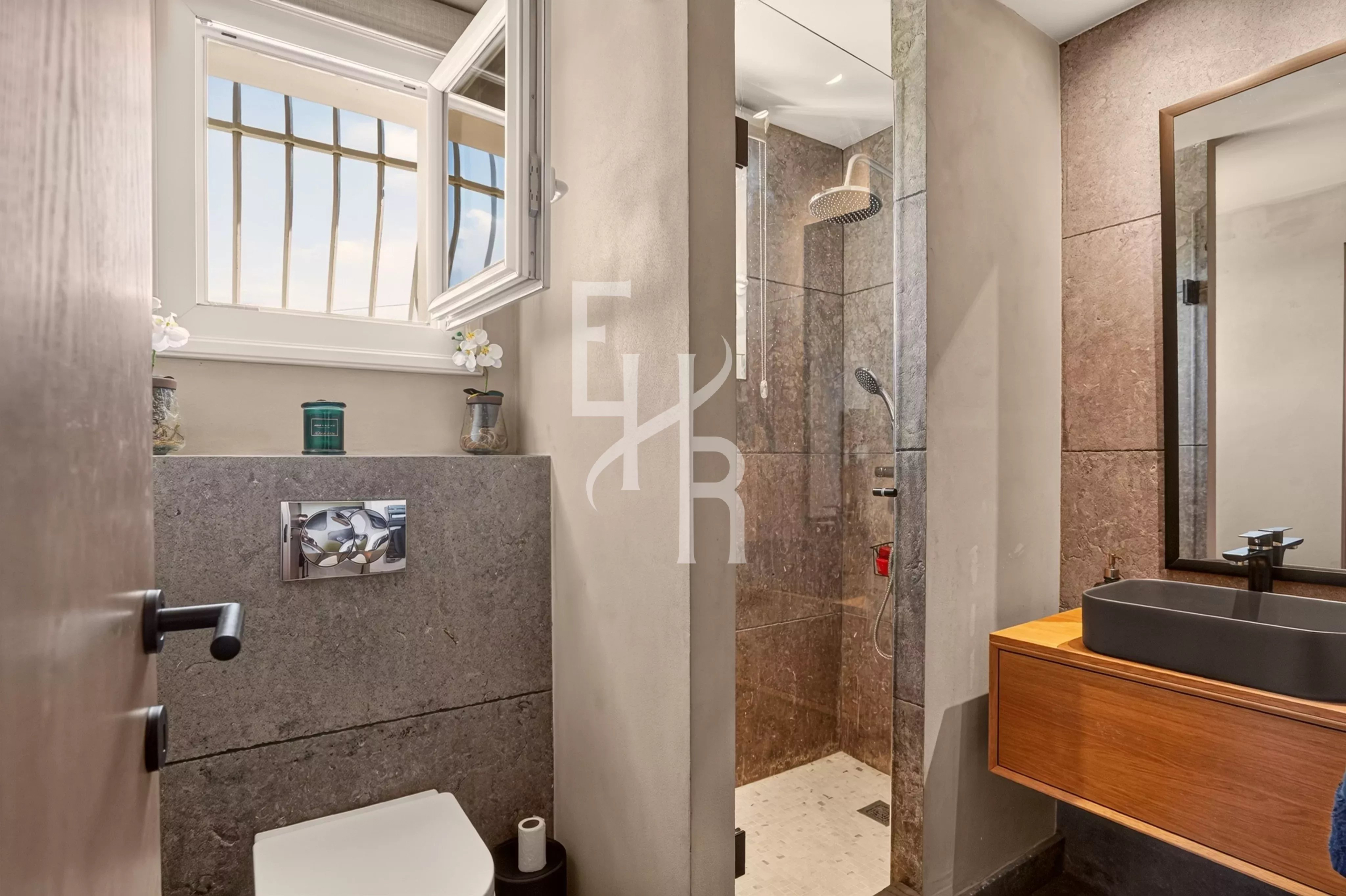 Elegant bathroom Modern bathroom with glass shower and wooden sink