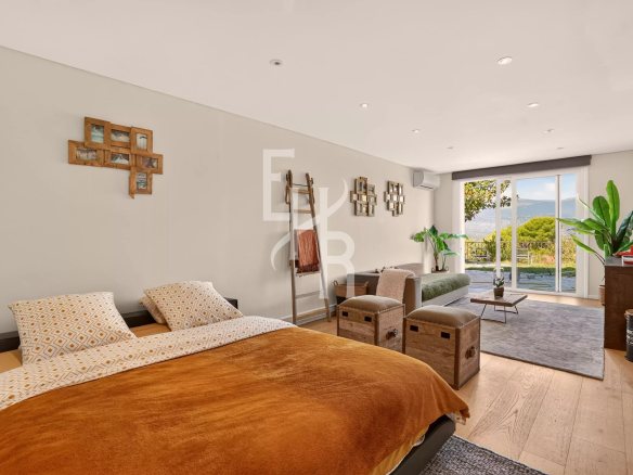 Room in a modern villa with views of the hills in Mougins, contemporary furniture and natural light.