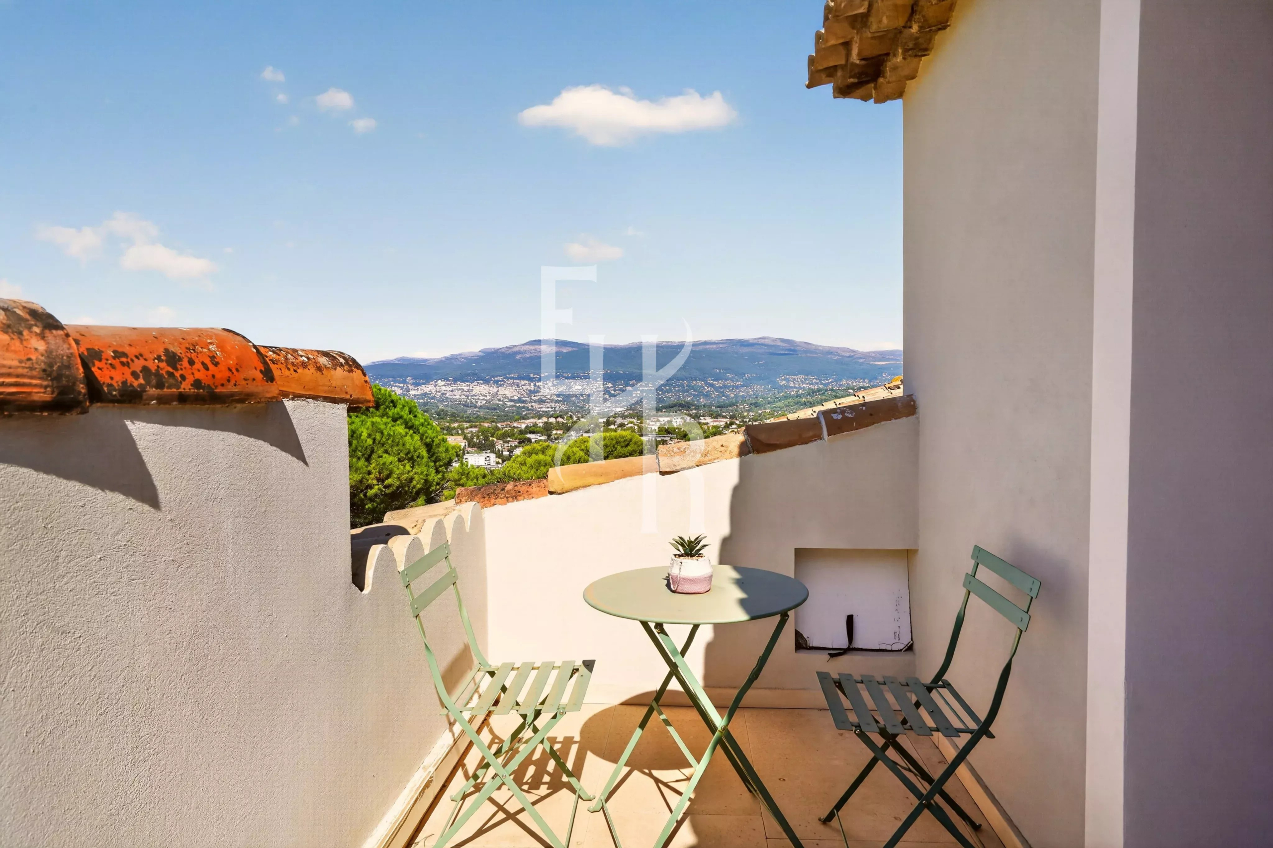 Terrace with a view in Mougins Terrace of a villa in Mougins with views of the hills and garden furniture