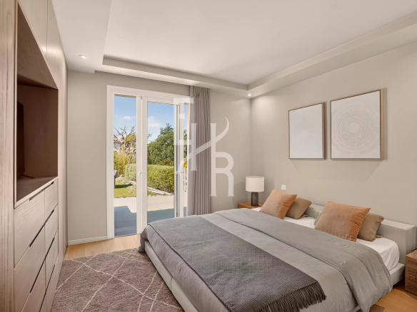 Room in a modern villa with outside access in Mougins, decorated with works of art.