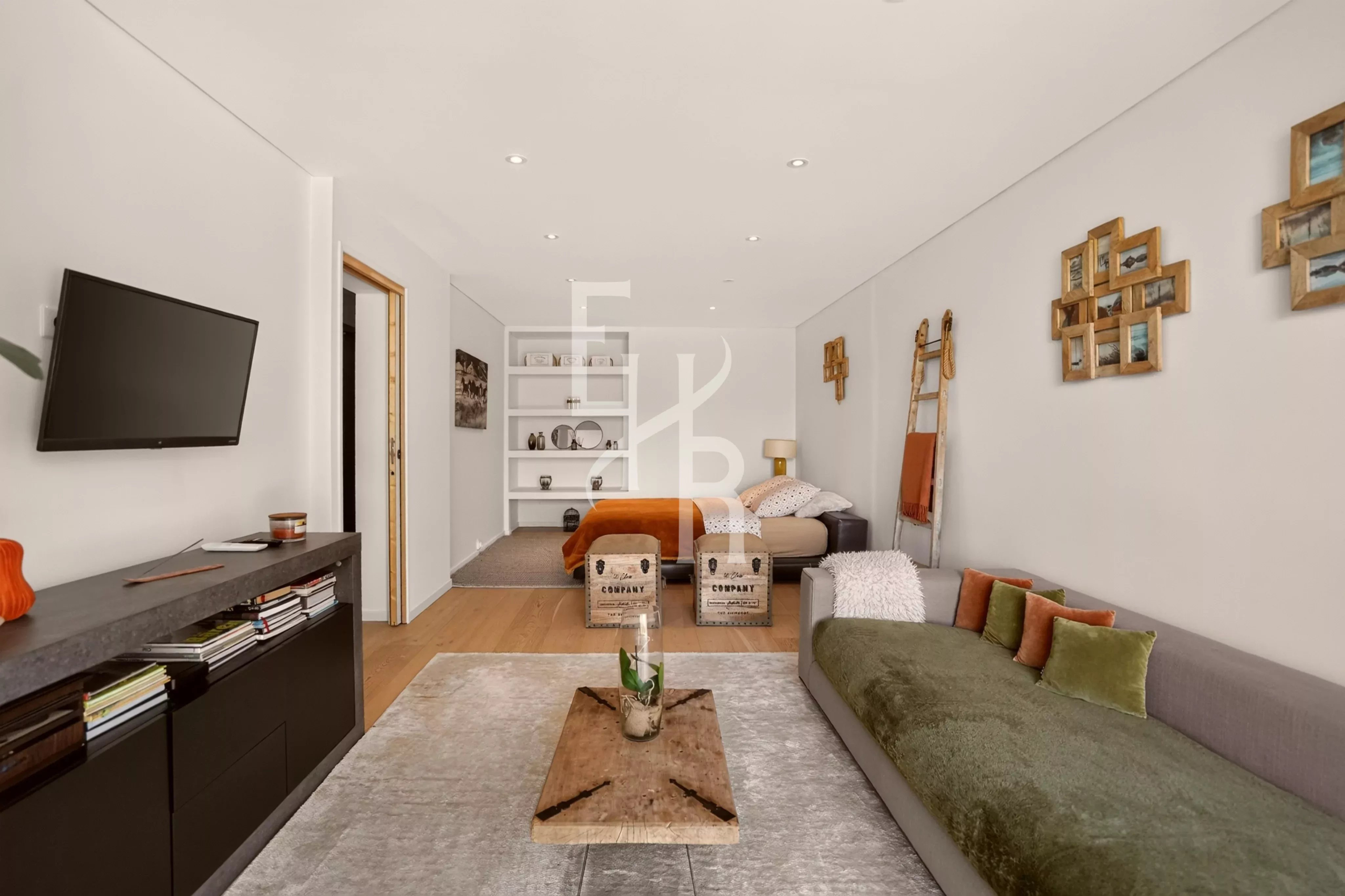 Interior of a villa in Mougins Interior of a modern villa with a bright living room, sofa and elegant decor.