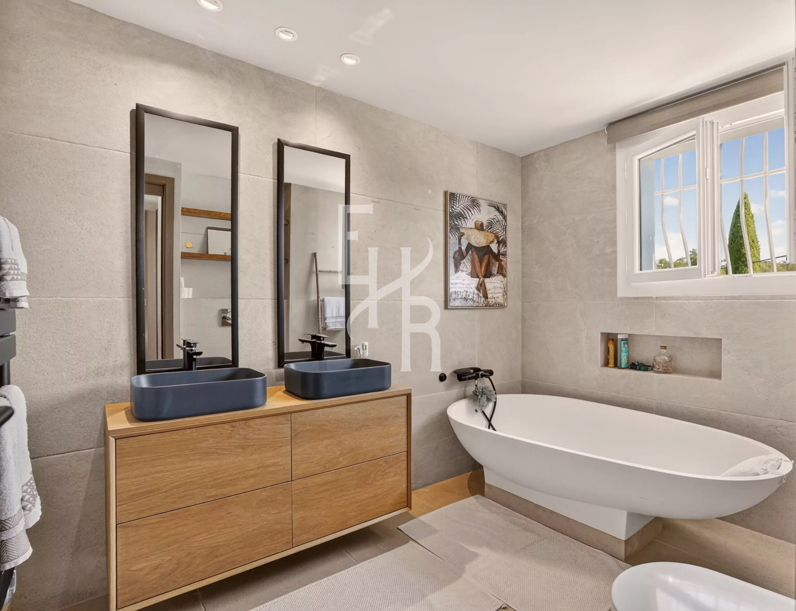 Elegant bathroom Modern bathroom with double sink and bathtub, grey stone walls.