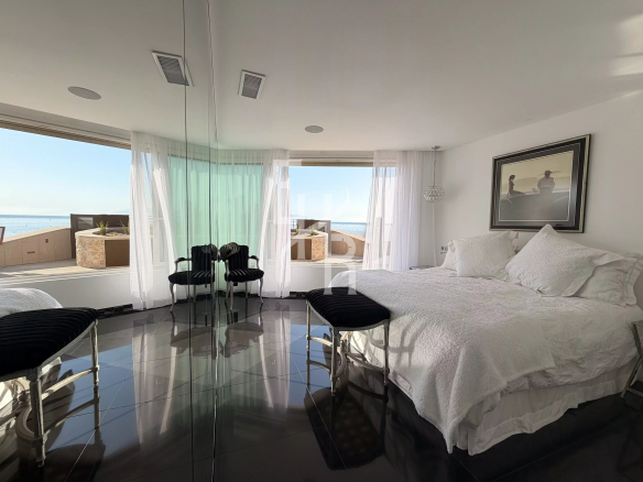 Bright room with views of the Mediterranean Sea, modern furniture and elegant decor.