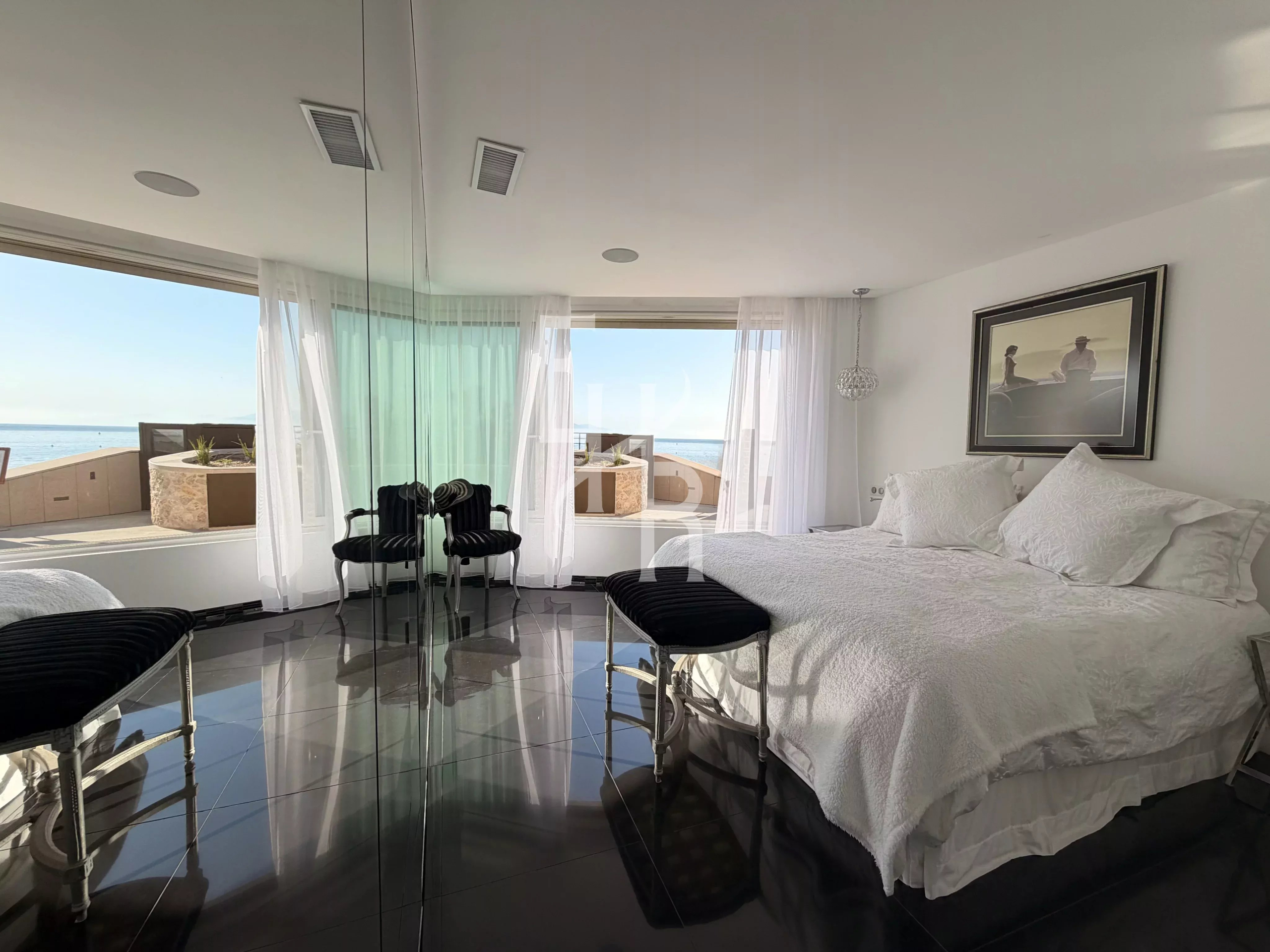 Room with sea view in Antibes Bright room with views of the Mediterranean Sea, modern furniture and elegant decor.