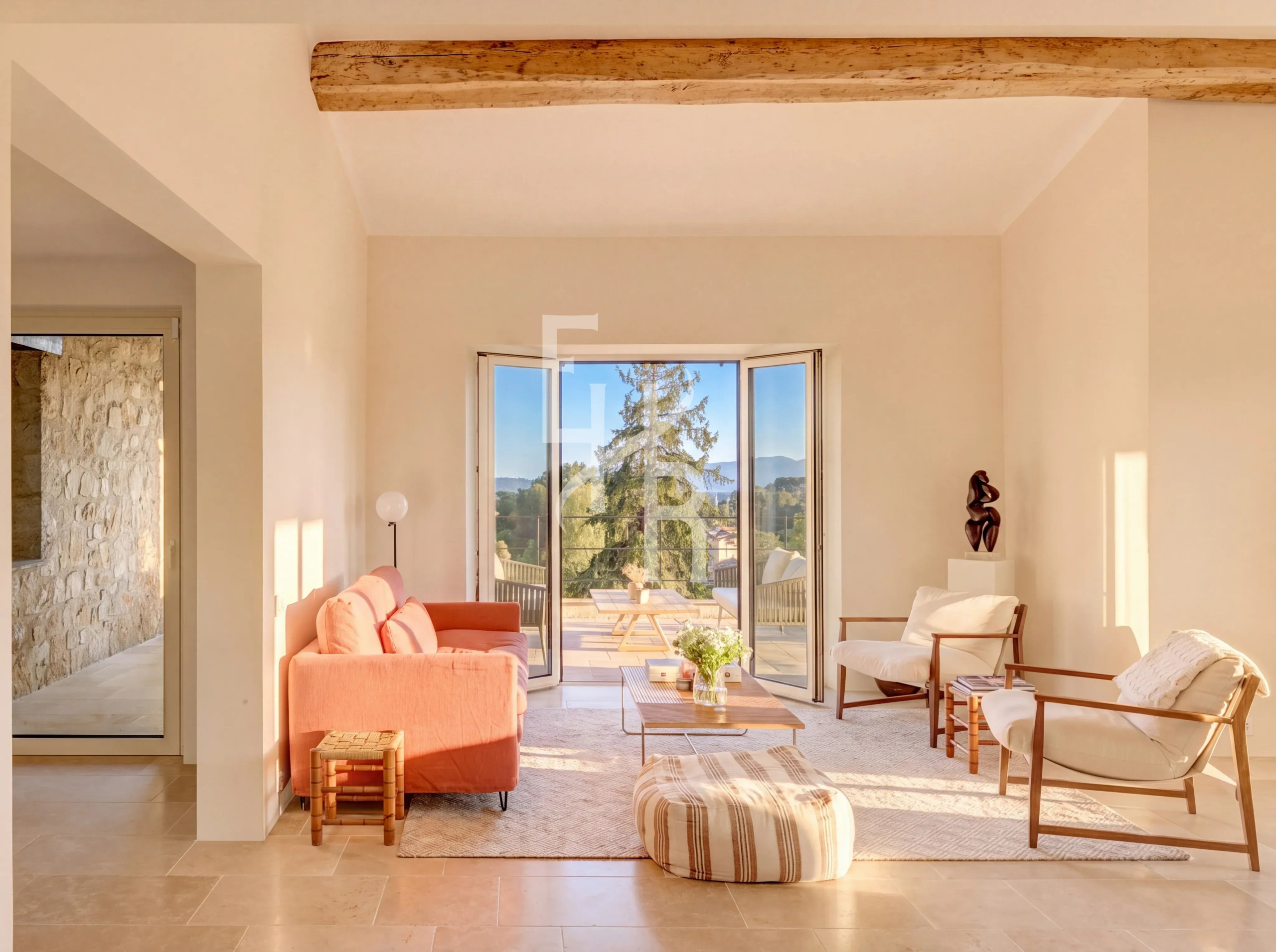 Interior of a country house in Mougins Bright interior of a bastide in Mougins with views of nature, modern furniture and Provençal charm.