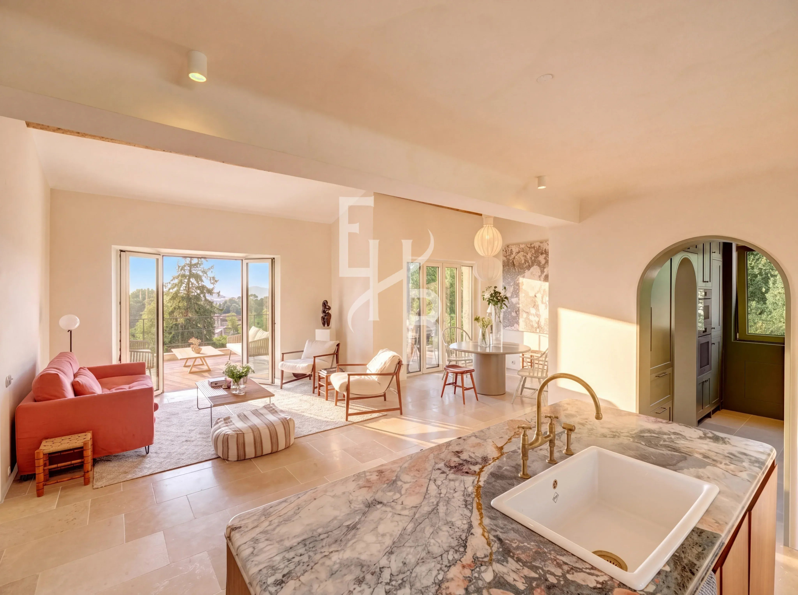 Modern country house in Mougins Interior of a modern country house in Mougins with a bright living room and marble kitchen.