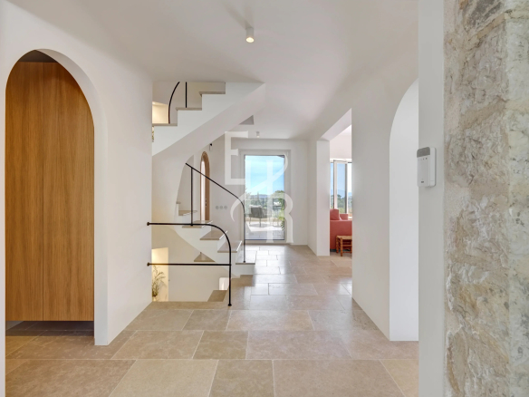 Interior of a modern country house with staircase and large windows in Mougins.