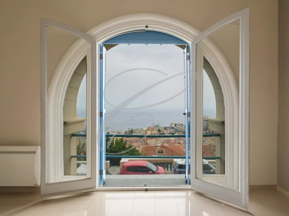 View from a window overlooking the sea and Monaco, in a spacious apartment in Beausoleil.
