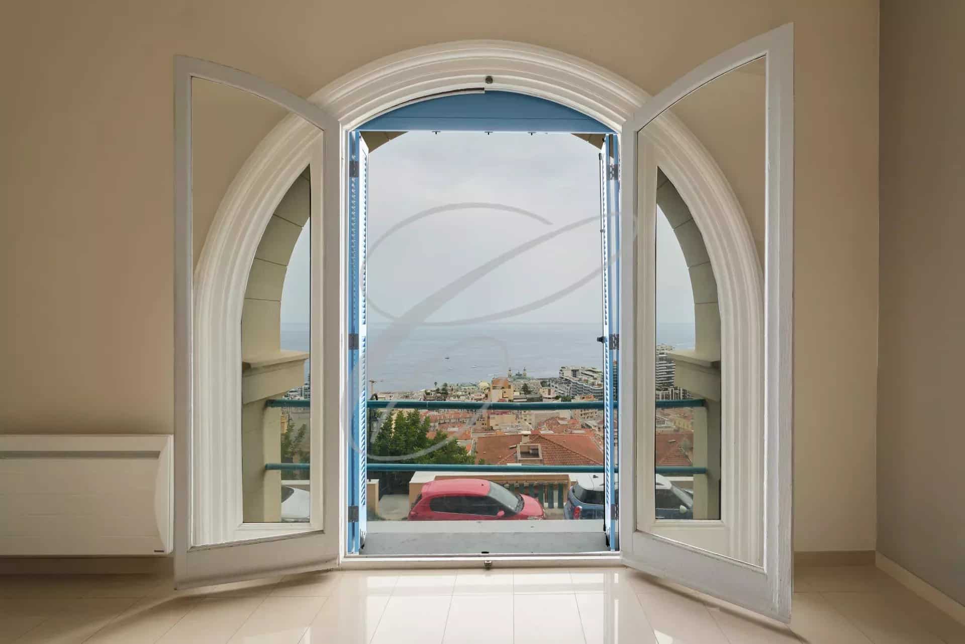 View from a window overlooking the sea and Monaco, in a spacious apartment in Beausoleil.