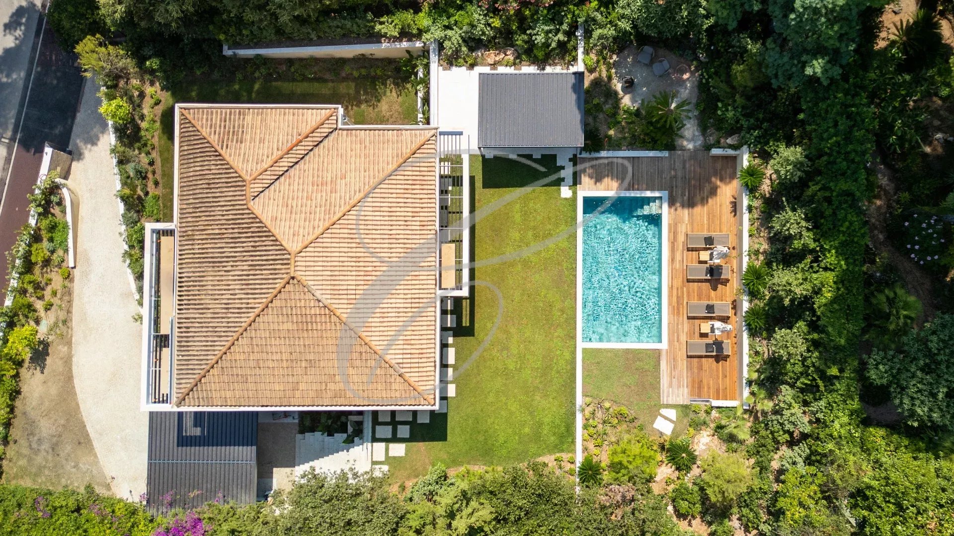 Luxurious villa in Roquebrune-Cap-Martin Aerial view of a luxury villa with swimming pool and garden in Roquebrune-Cap-Martin.