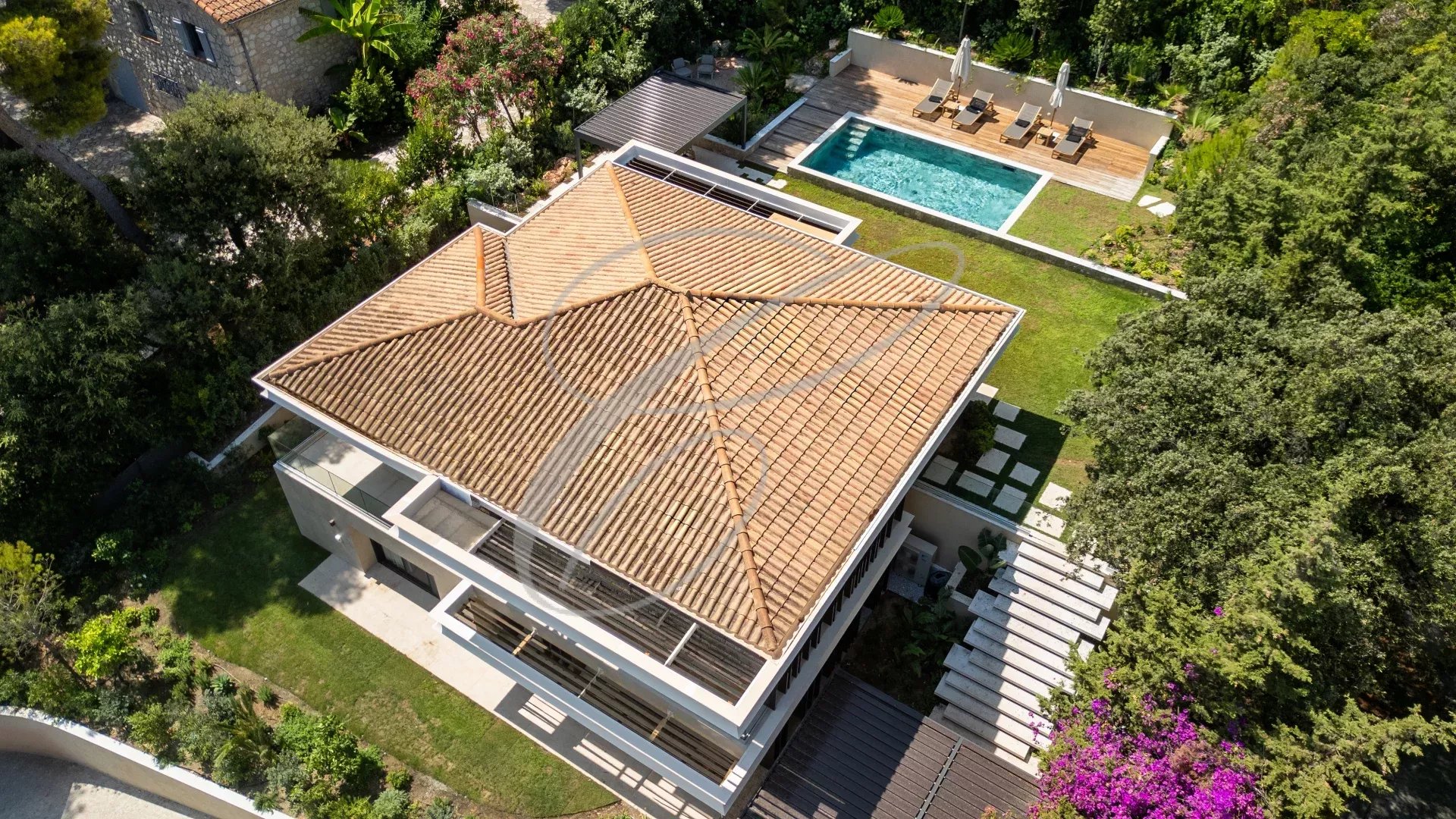 Luxurious villa in Roquebrune-Cap-Martin Aerial view of a luxury villa with swimming pool and garden in Roquebrune-Cap-Martin.