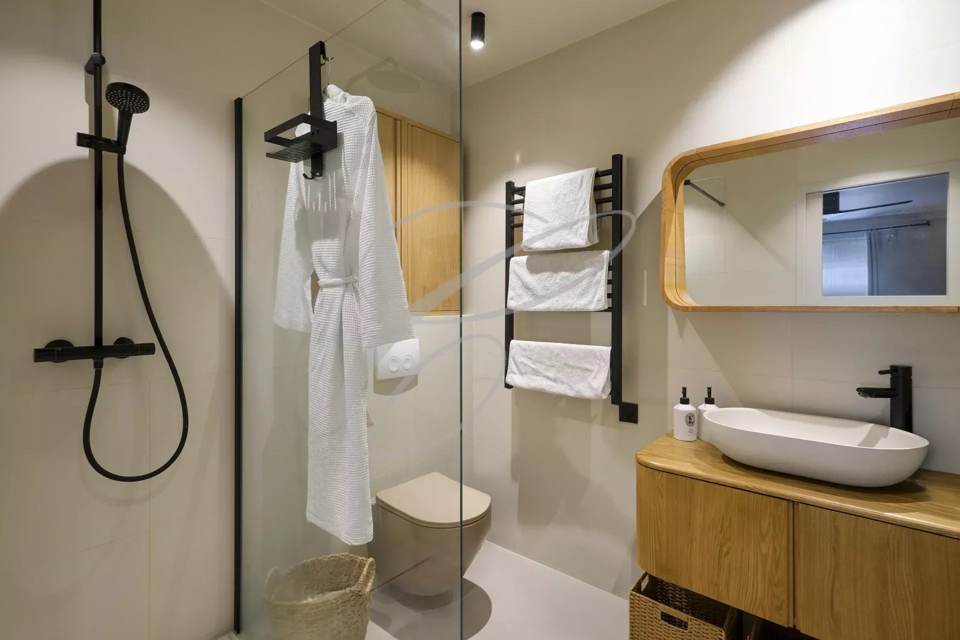 Renovated shower room Modern shower room with walk-in shower and wooden vanity unit.