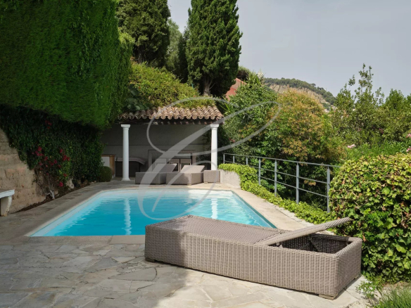 Swimming pool surrounded by greenery in a villa in Roquebrune-Cap-Martin.