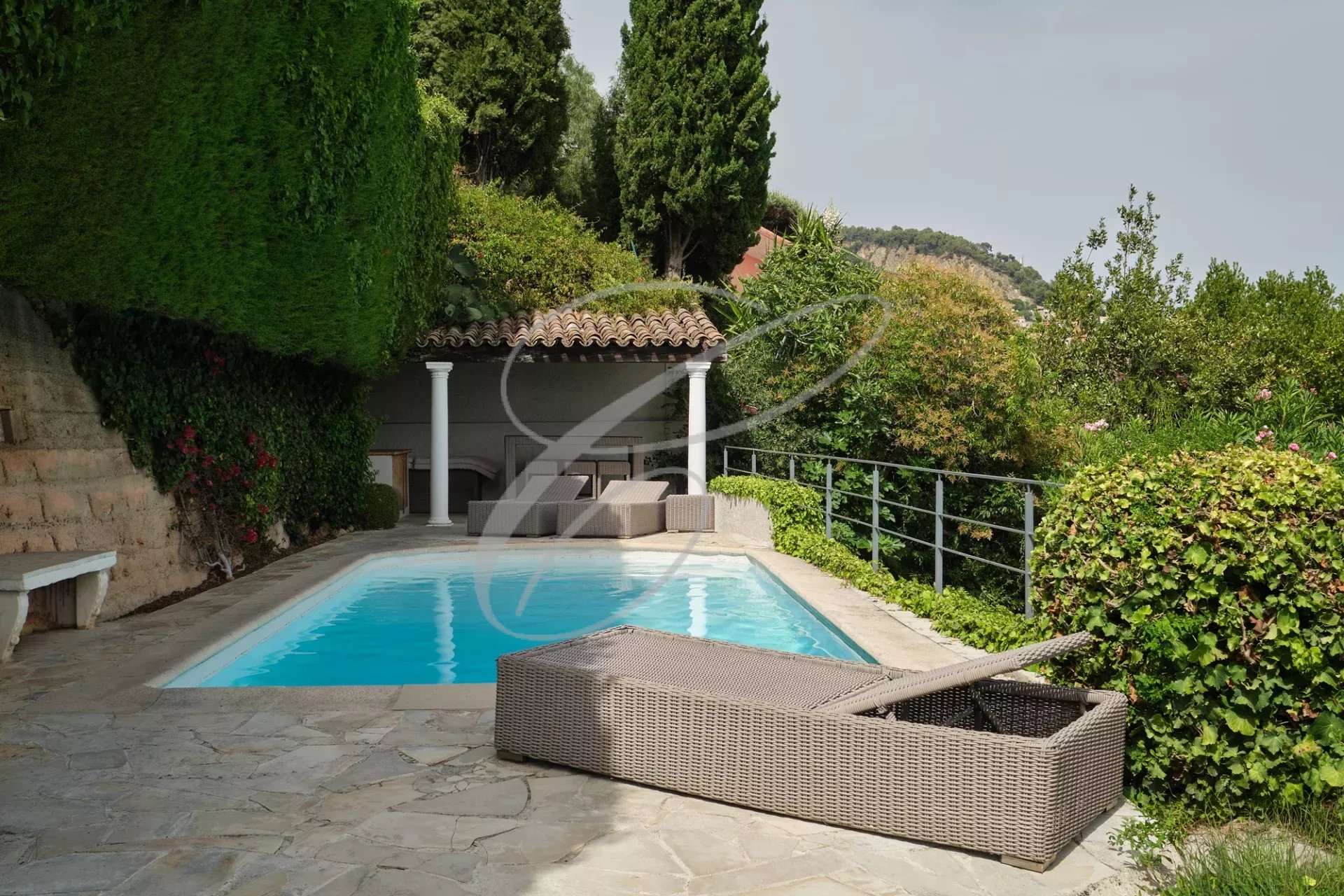 Villa with swimming pool in Roquebrune-Cap-Martin Swimming pool surrounded by greenery in a villa in Roquebrune-Cap-Martin.