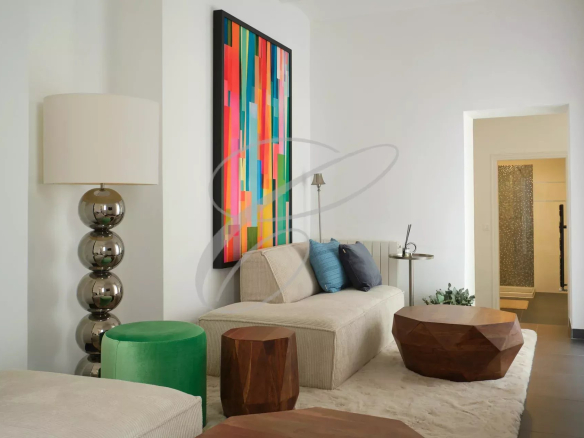 Interior of a villa in Roquebrune-Cap-Martin with a modern living room and colorful decoration.