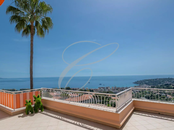 Panoramic sea view from a palm tree terrace in Roquebrune-Cap-Martin.