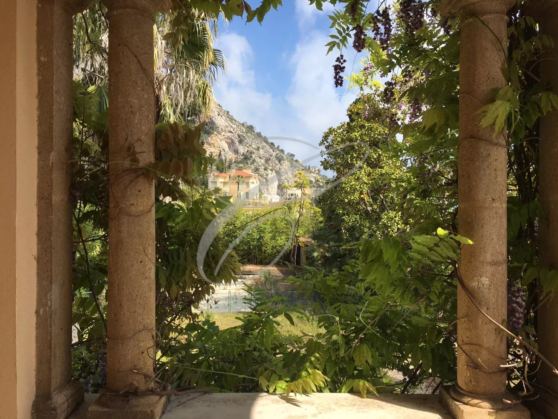 Property in Menton Garavan View of an exotic park with swimming pool and villa, Menton Garavan