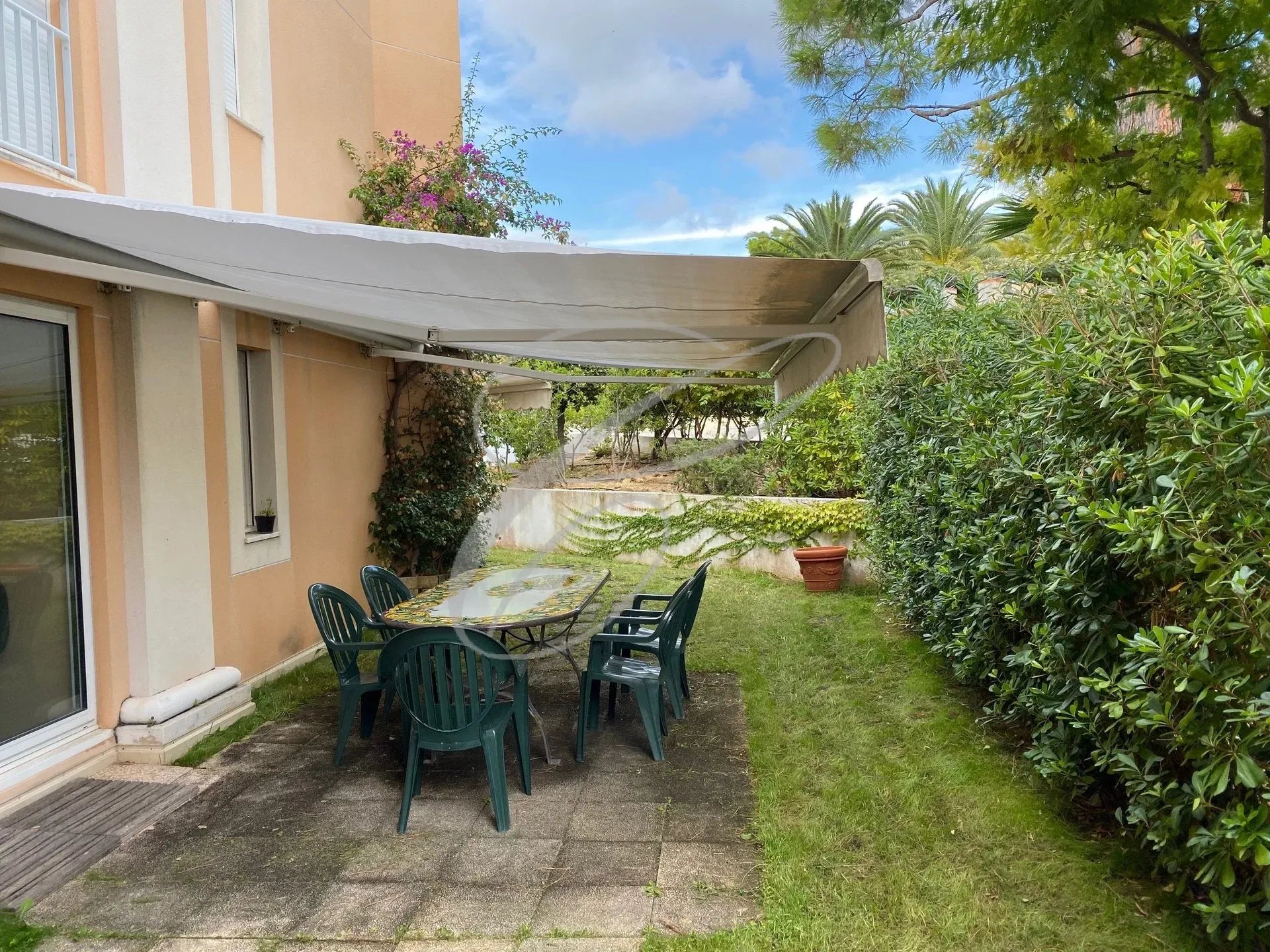 Terrace and private garden in Roquebrune-Cap-Martin Terrace with table and chairs in a private garden of a residence in Roquebrune-Cap-Martin