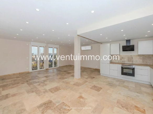 Interior of a renovated terraced house with open kitchen and bright space in Mougins.