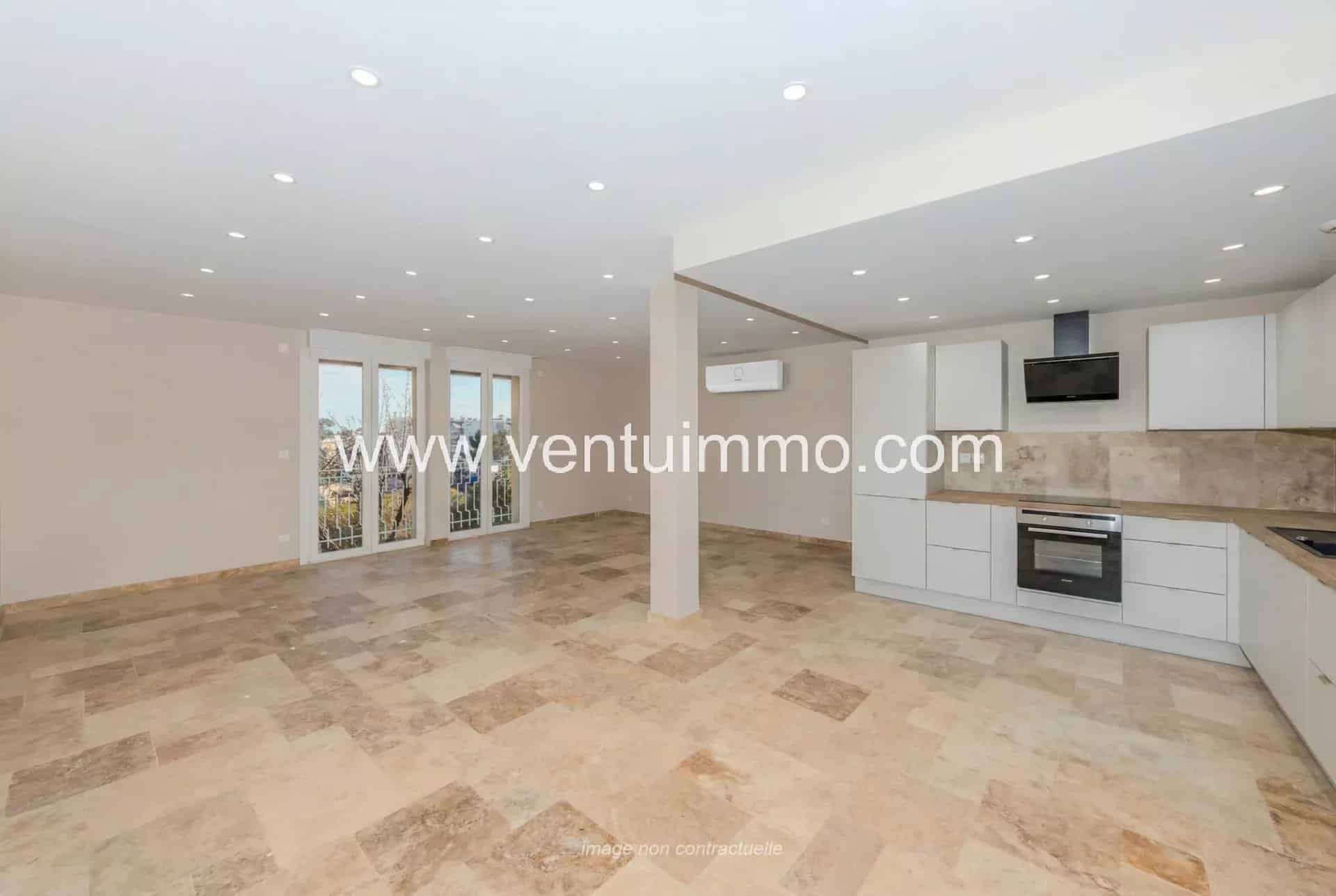 Interior of a renovated terraced house with open kitchen and bright space in Mougins.