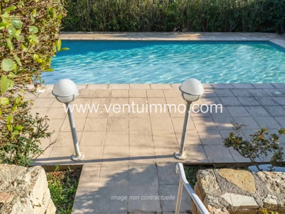 Shared swimming pool in a residence in Mougins, with terrace and garden.