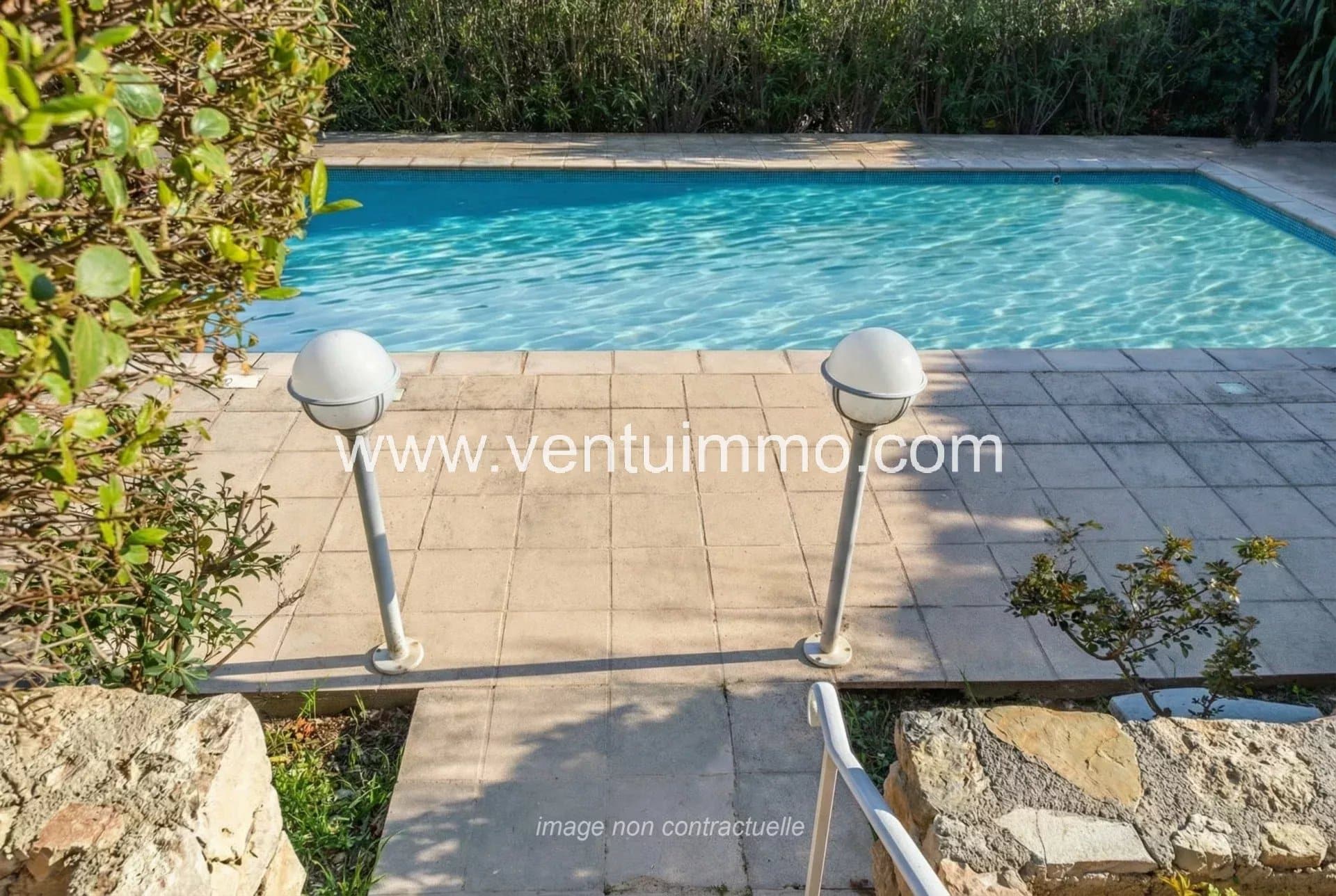 Shared swimming pool in a residence in Mougins, with terrace and garden.