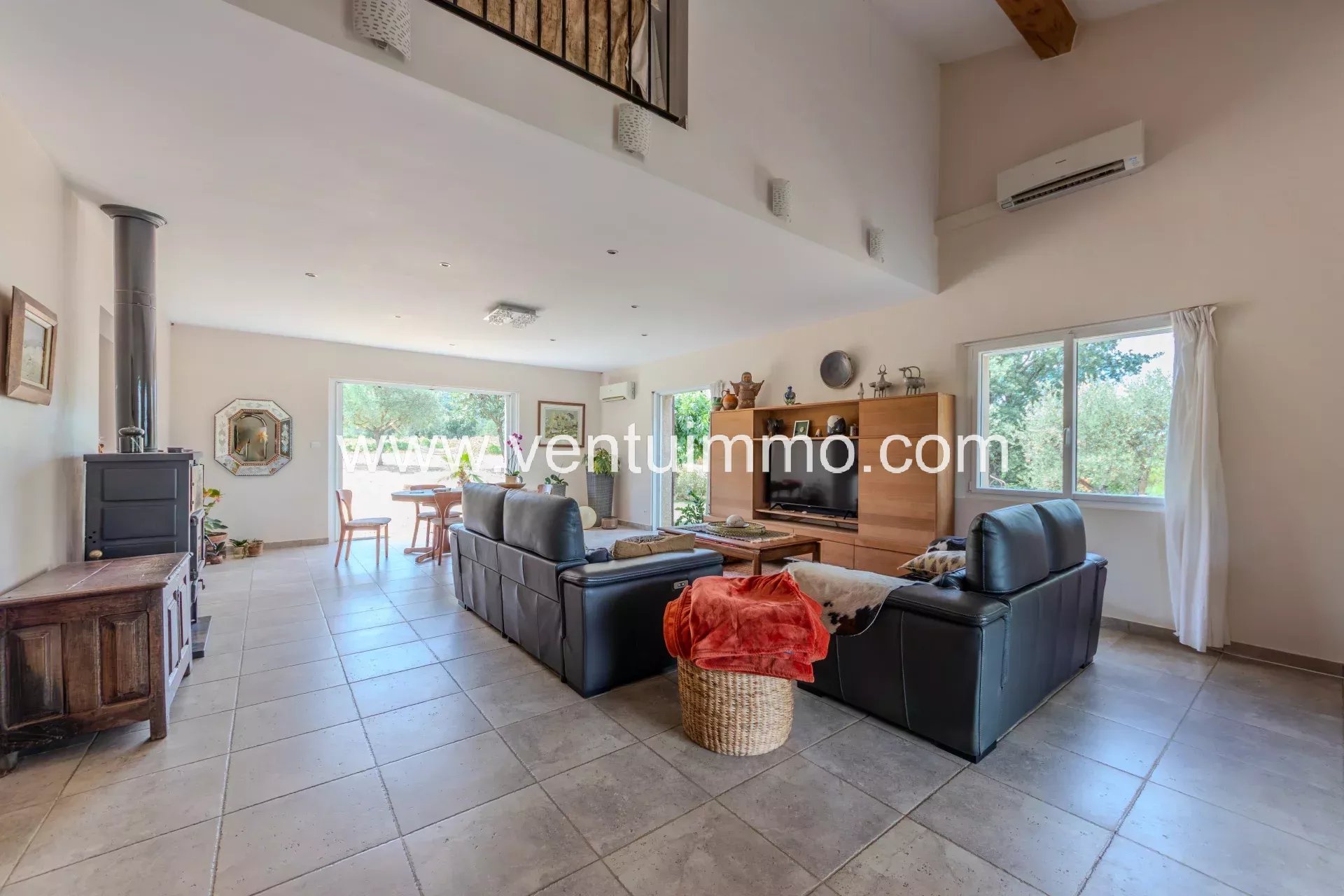 Interior of a house in La Garde-Freinet Interior of a house in La Garde-Freinet with spacious living room and dining area.