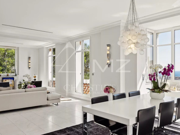 Interior of a renovated villa with sea views, contemporary furniture and abundant natural light.
