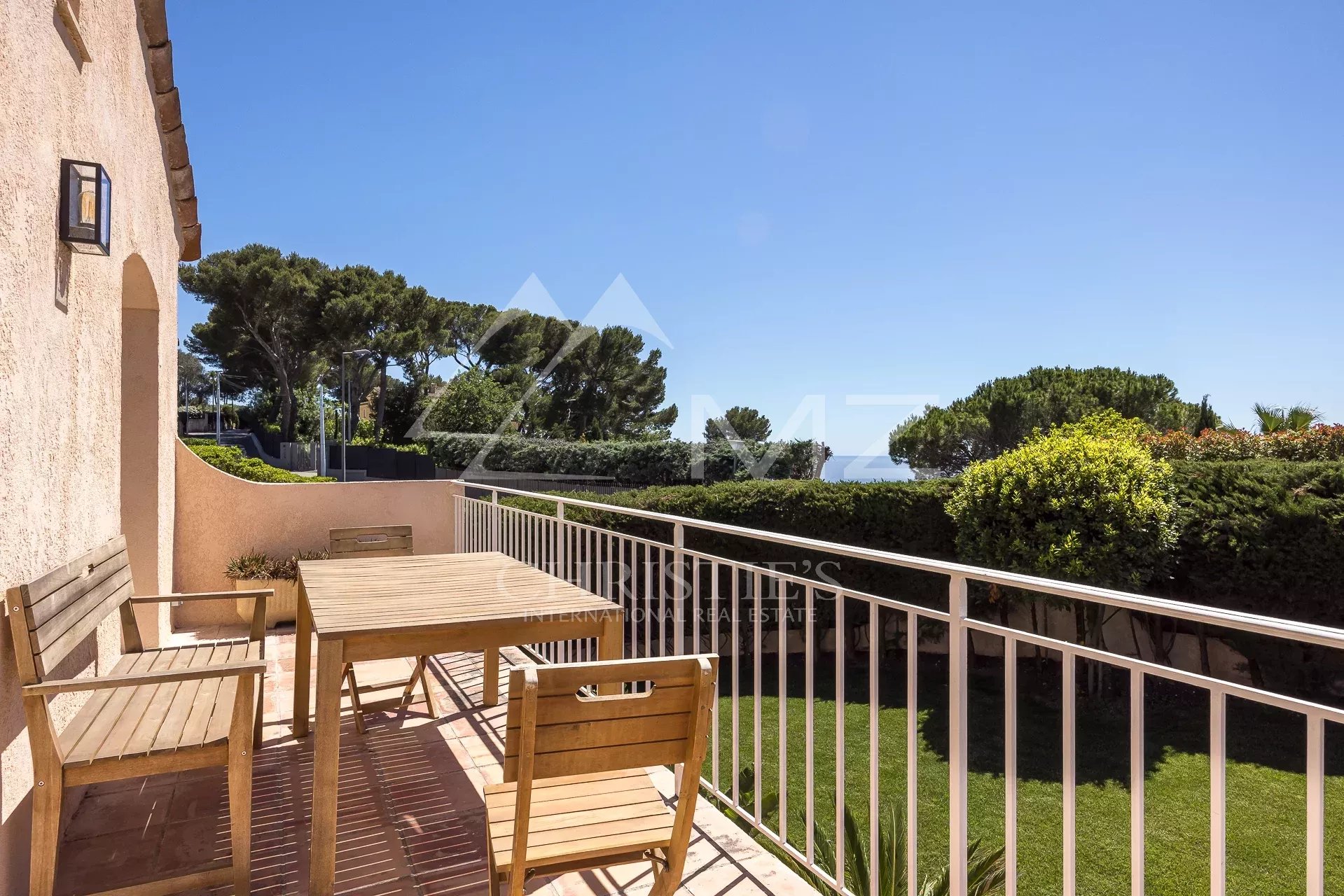 Wooden terrace with garden and sea views, family home in the hills above Cannes.