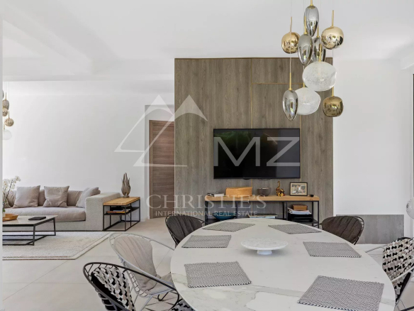 Modern interior of a family home with a bright dining room and living room.
