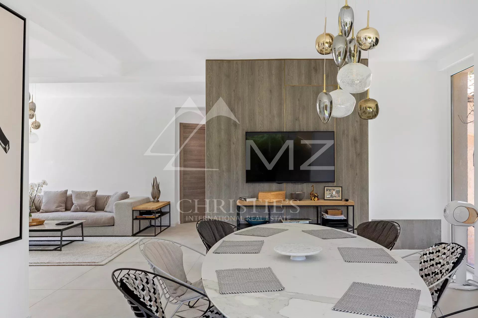 Modern interior of a family home with a bright dining room and living room.